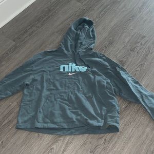 nike “sweatshirt”. it is like a long sleeve shirt material with a hood on it